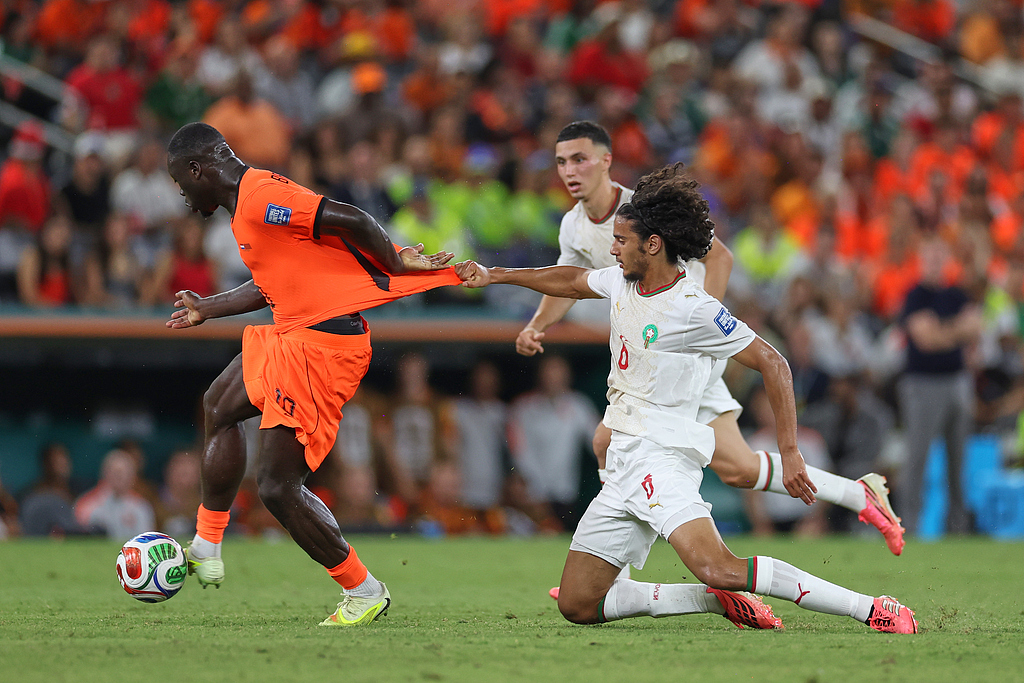 Morocco's Ayyoub Bouaddi grabs Netherlands' Brian Brobbey jersey