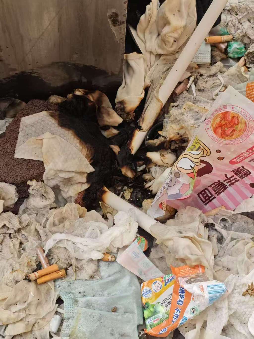 Cigarette butts tossed from windows once set fire to debris below Yang Zeyu's dormitory