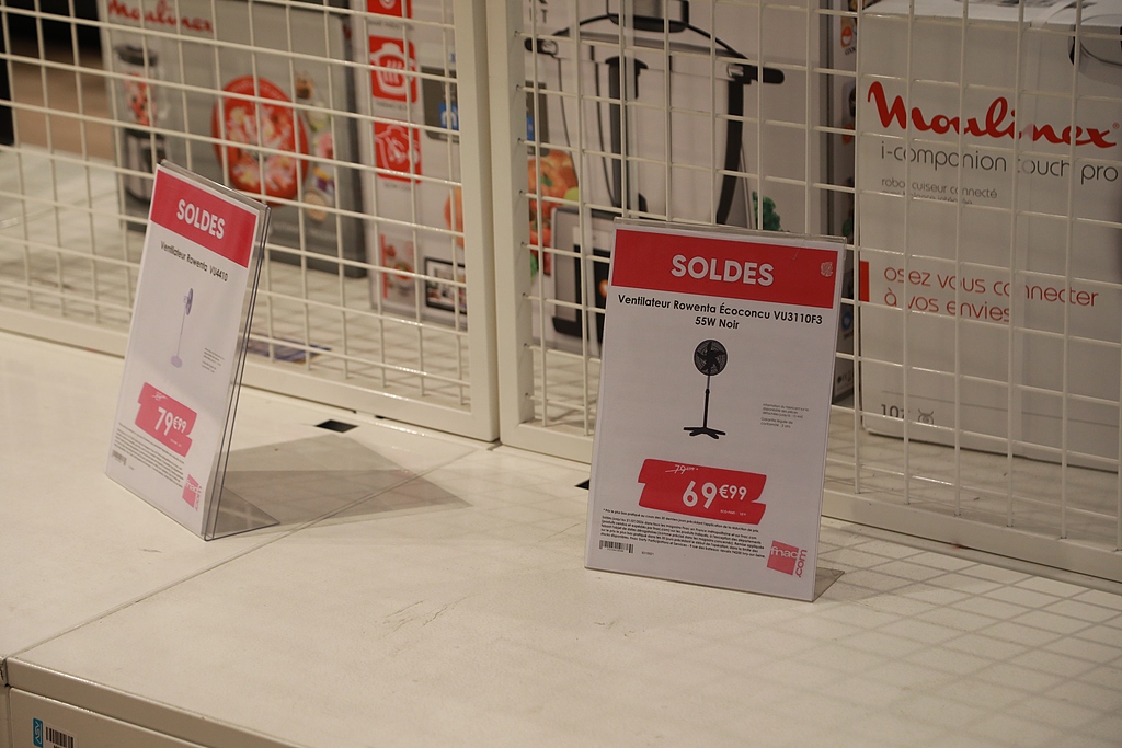 Paris electronics store with sold-out fans and AC units during heatwave